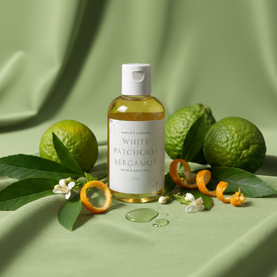 Bottle of White Patchouli Bergamot oil with green fruits and leaves on a green background